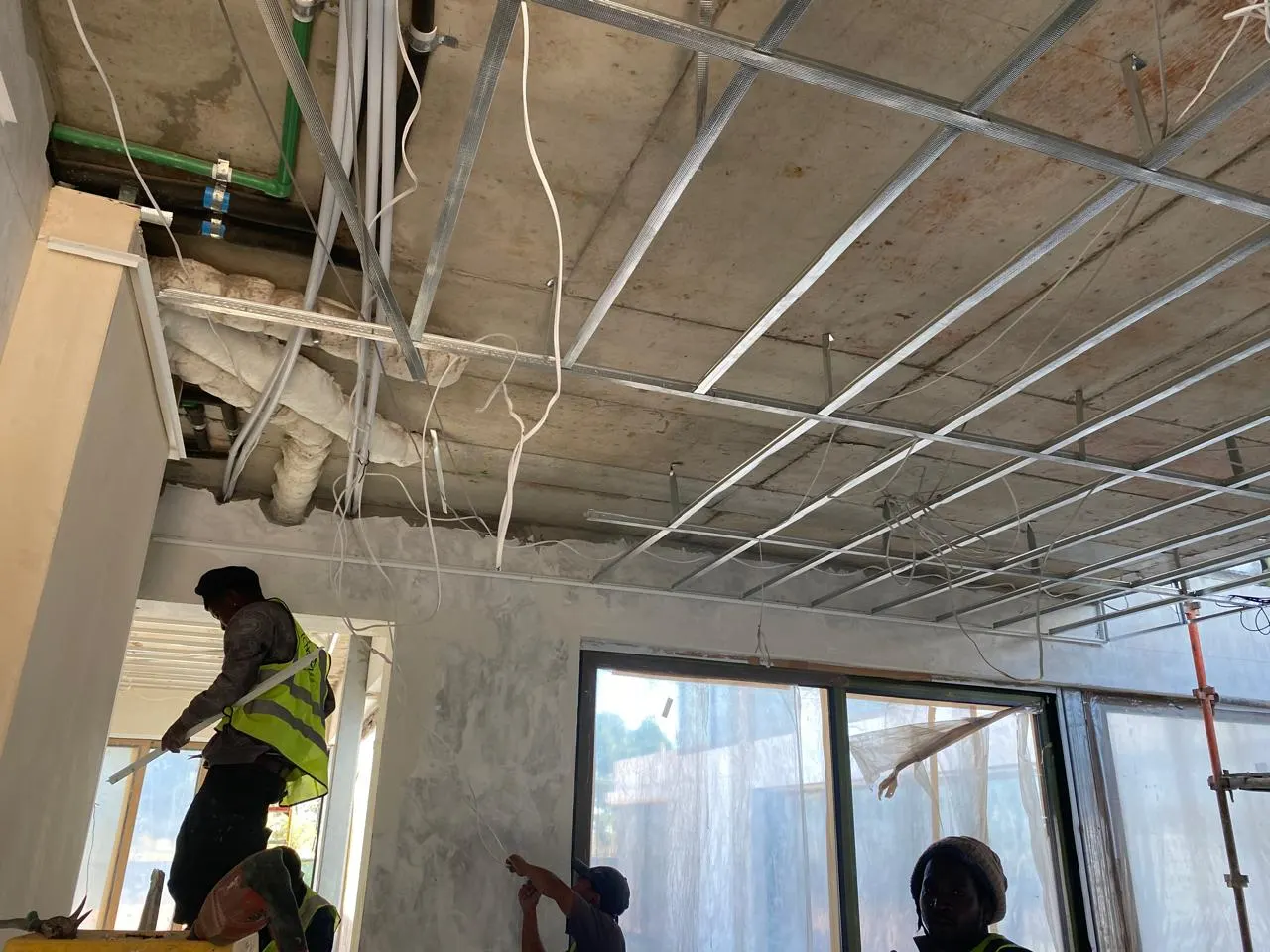 KAM Electrical team wiring a ceiling installation near Bridgetown